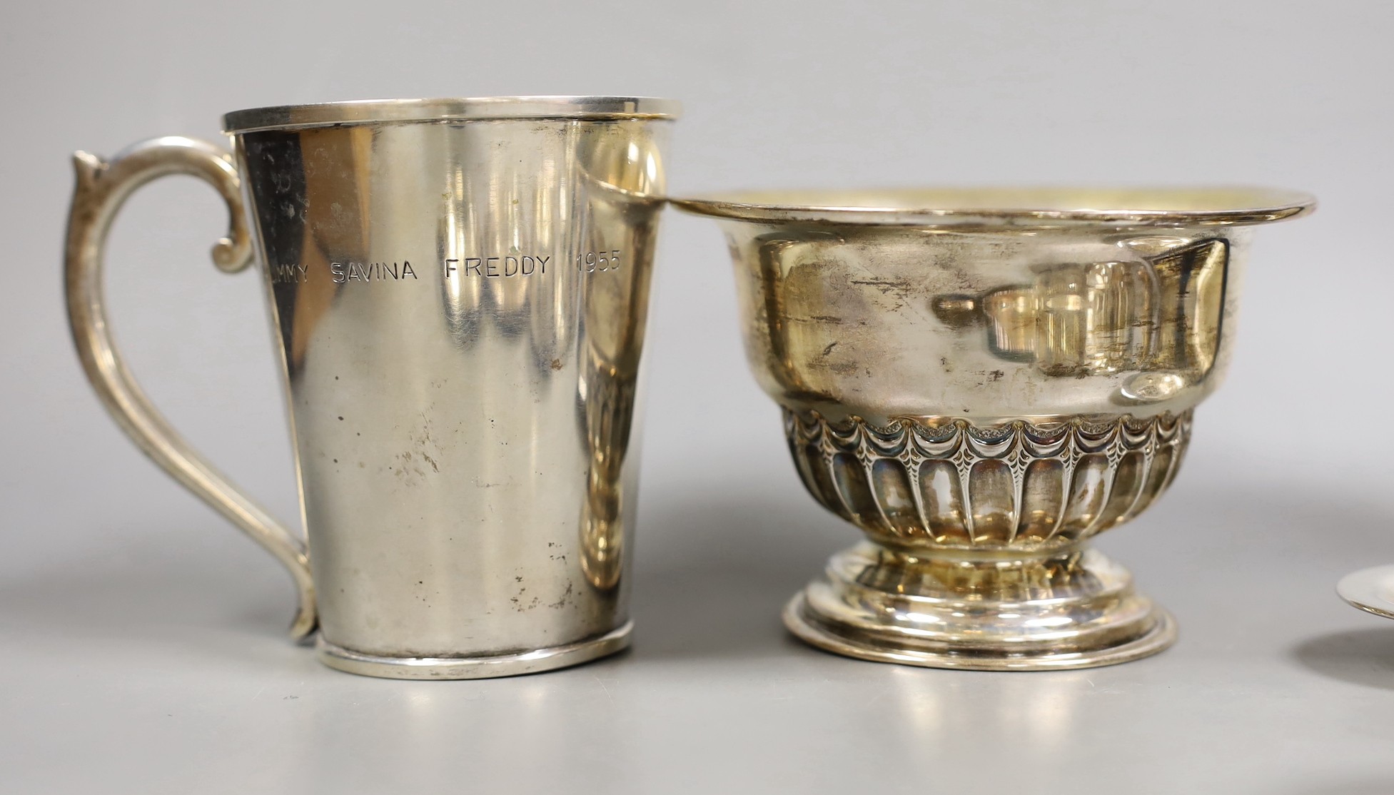 A late Victorian repousse silver pedestal bowl, Sheffield, 1898, diameter 12.8cm, three later silver dishes, a silver bowl, pill box and damaged tea strainer, eight Greek white metal items and a plated tongs.